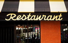An awning with “Restaurant” written in large letters.